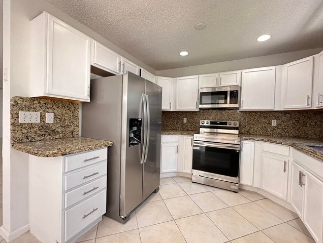 Greenacres Townhome: 703 Crosswinds Drive